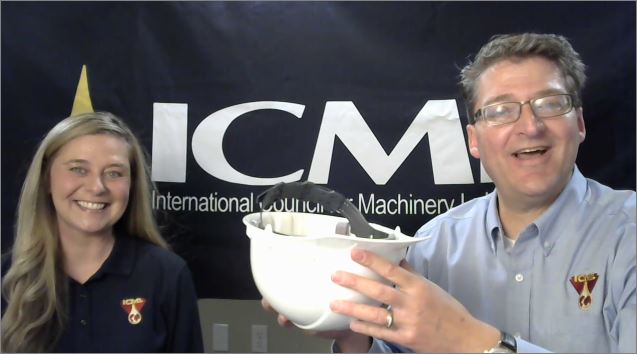 Leslie and Paul conduct the Q1 drawing with a hard hat and ball bearings.
